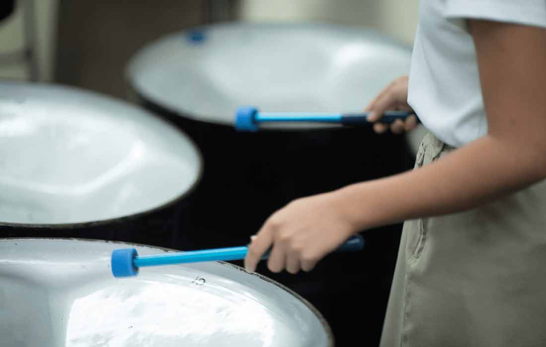 Close up of student playing kettle drums